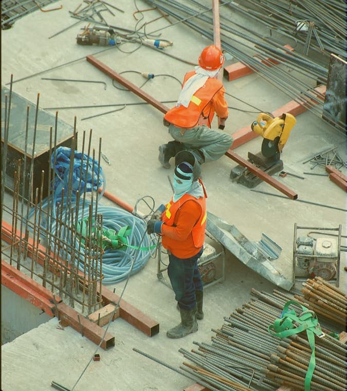 Blibo site team working across reinforcement steel on a slab pour