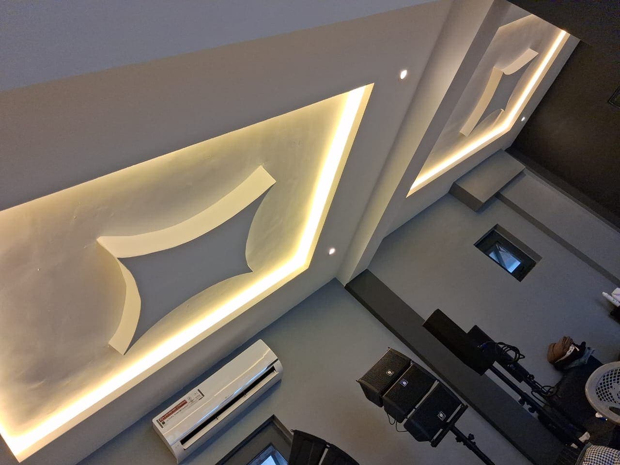 Commercial reception hall in Keta with a star POP ceiling relief and warm cove lighting
