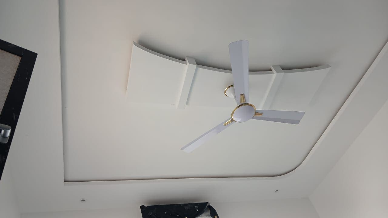Newly fitted curved POP ceiling band and ceiling fan in a Keta home, photographed before final decorating